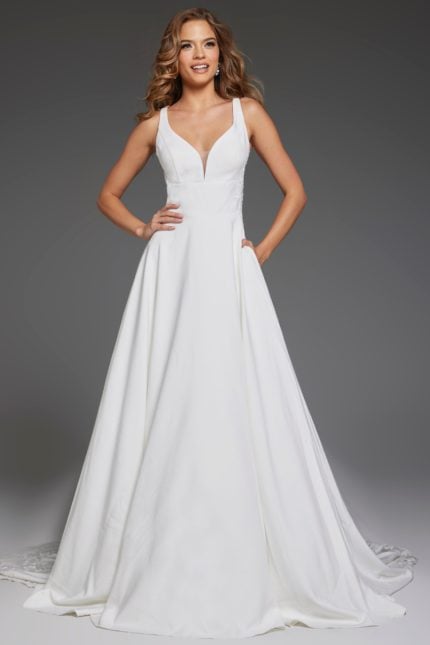 Model wearing Jovani JB42294 ivory gown with deep V-neck and A-line silhouette.