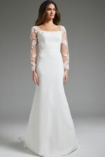 Model wearing Jovani JB42297 ivory gown, full-length front view with lace sleeves.