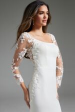 Close-up of Jovani JB42297 ivory gown, featuring a square neckline and intricate lace sleeves.