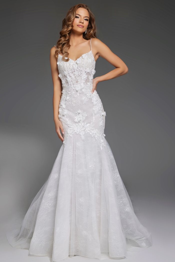 Bride wearing a lace mermaid wedding dress with floral details JB42484