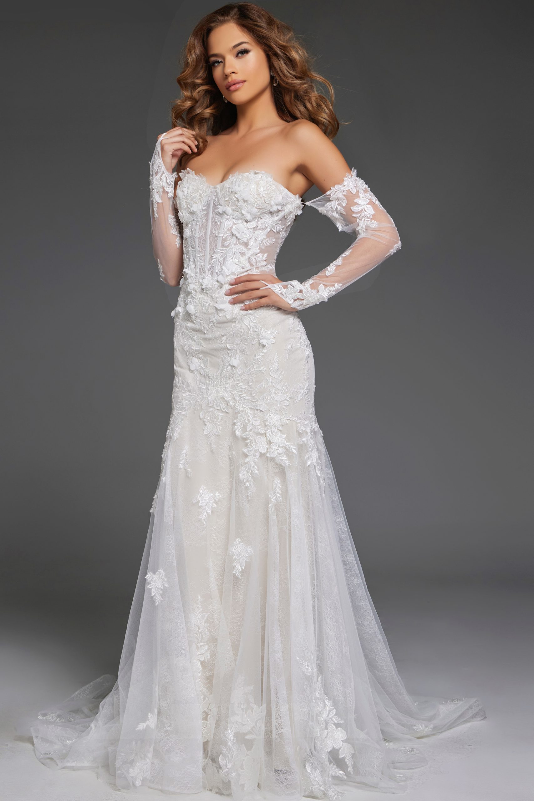 Bride wearing an off-shoulder lace wedding gown with floral details JB42486