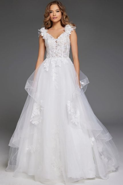 Model wearing Jovani JB43314 ivory ball gown with floral appliques and V-neckline.