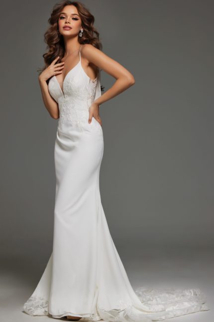 Model wearing Jovani JB43322 ivory gown with V-neckline and lace appliqués.