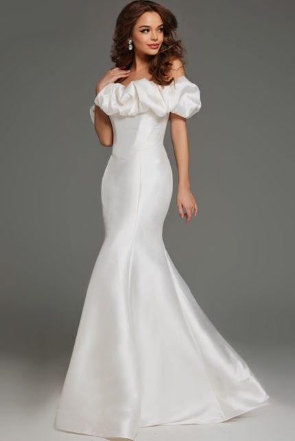 Model wearing Jovani JB43896 ivory gown with puff sleeves and mermaid silhouette from the front view.