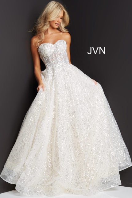 Model wearing Jovani 08417 A-line ivory dress with all-over sequins.