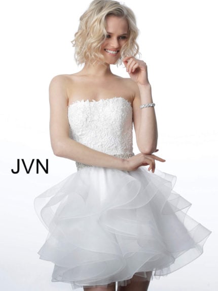 Model wearing Jovani 3099 white short dress with lace bodice and ruffled skirt front view