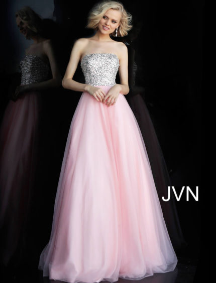 Model wearing Jovani 52131, a blush strapless gown with a sparkling bodice and tulle skirt.