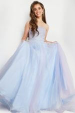 model wearing Jovani K02229 blue front view gown holding full tulle skirt