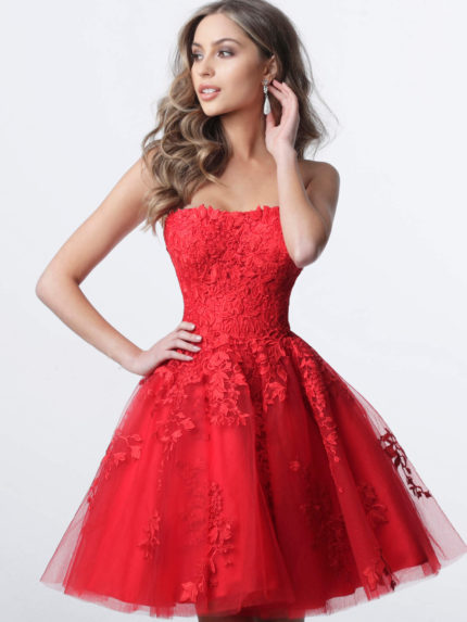 Model wearing K1830 dress in red with floral lace appliqués, front view