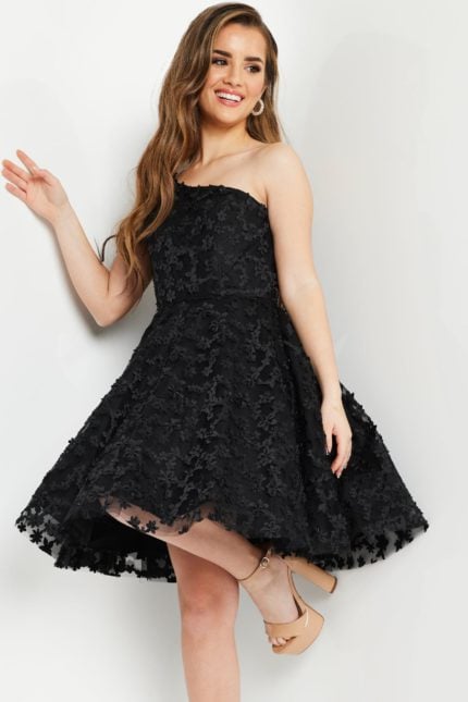 model wearing K23516 black dress in a front view, showcasing the floral details.