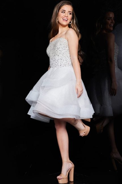 Model wearing Jovani K24050 ivory short dress in front view.