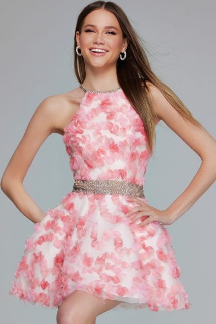 Model wearing K26290 pink cocktail dress with embellished waist, front view.