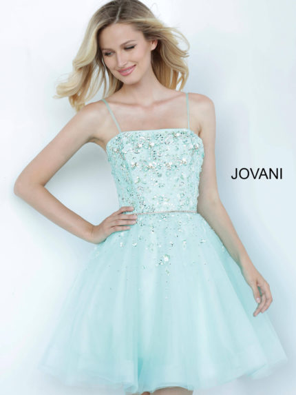 Model wearing Jovani K3641 blue A-line dress with intricate beadwork and square neckline.