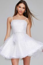 Front view of Model twirling in Jovani K38313 white dress.