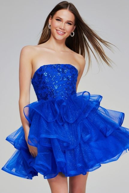 model wearing K38440 dress in royal with a strapless neckline and ruffled skirt