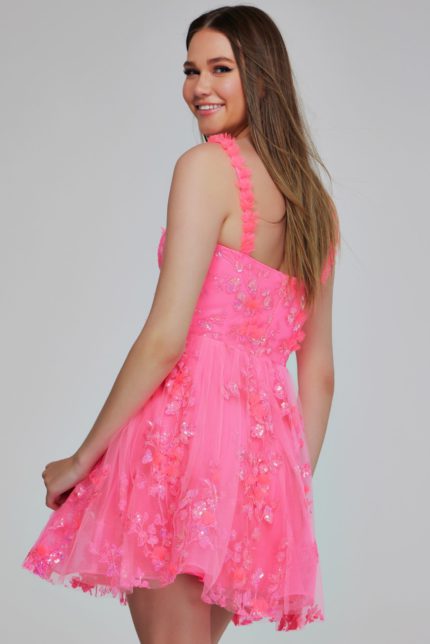 Back view of model wearing K39141 pink dress with floral embellishments.