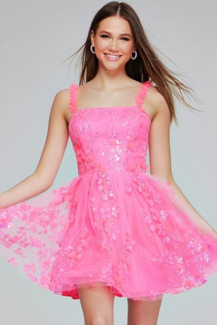 Model wearing K39141 pink dress with A-line silhouette and floral embellishments, front view.