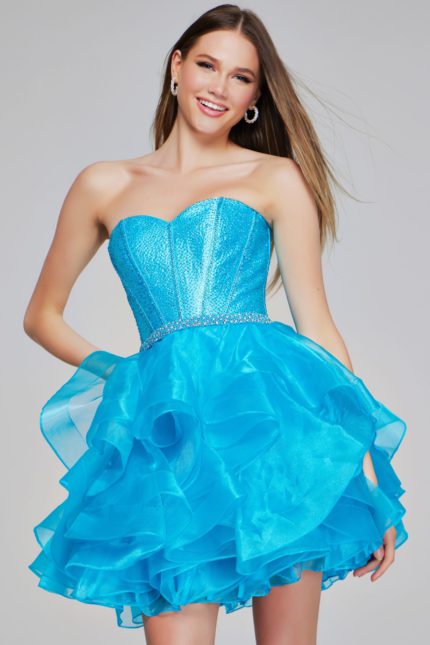 Model wearing Jovani K39311 turquoise mini dress with sweetheart neckline and ruffled skirt.