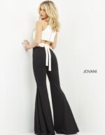 Model in Jovani M02807 showing black and white jumpsuit, front view.