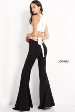 Model wearing Jovani M02807 showing the back and flowing leg design.