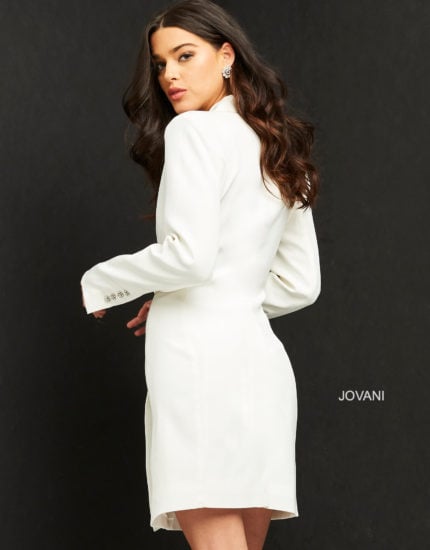 Back view of model in Jovani M1265 ivory dress, showcasing the elegant cut and long sleeves.