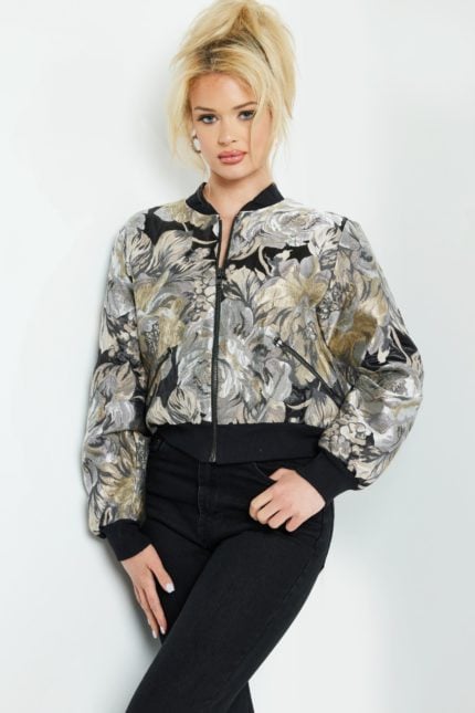 Model wearing Jovani M51288 multi-colored floral bomber jacket, front view.