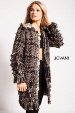 Model elegantly poses in Jovani M54805 tweed coat with extended length and classic design in multi-color.