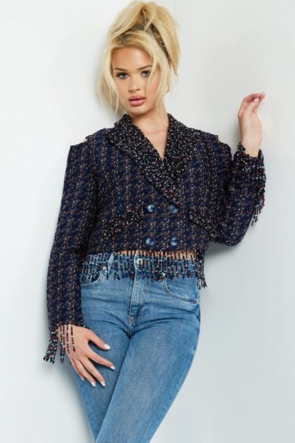 Model wearing Jovani M61912 jacket with double-breasted front and fringe trim in multi.