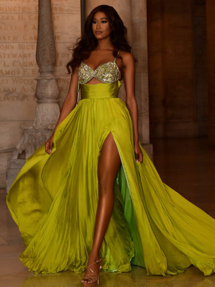 Model wearing Jovani S05823 with sweetheart neckline and high slit in green, front view