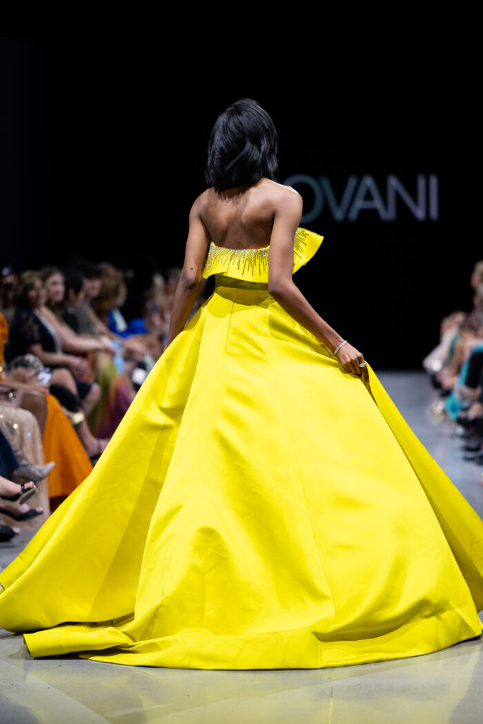 Model wearing Jovani S36369 Yellow off the Shoulder Couture Dress