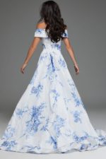 Model wearing Jovani S38939 front view of white and blue off-the-shoulder dress with floral patterns.