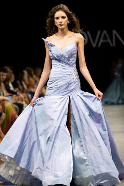 model wearing S39128 floor-length dress with sweetheart neckline and high slit, in multi-color