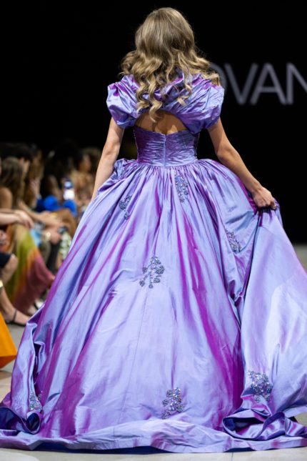 Back view of model wearing Jovani S39133 purple gown with embellished skirt