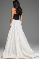 back view of model wearing S67083 black and white gown with strapless design