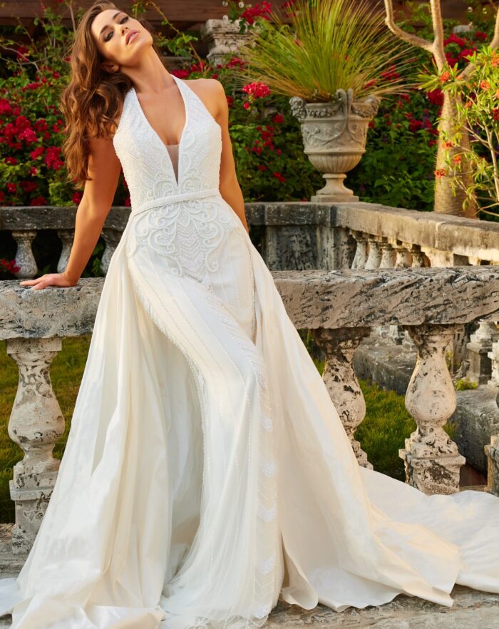 Model wearing Off White Embellished Halter Neck Bridal Dress