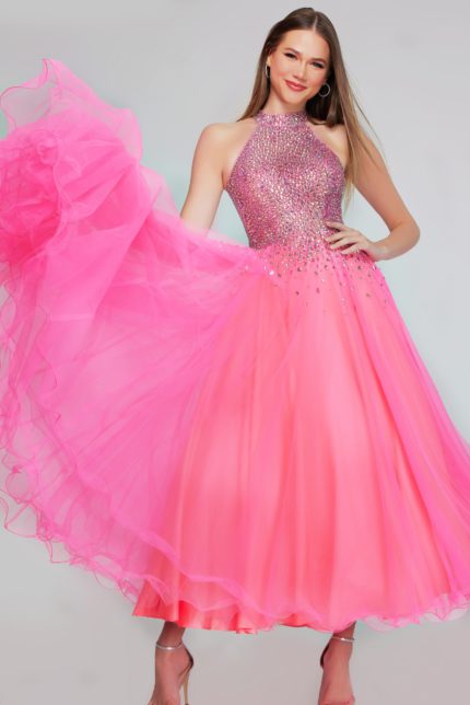 Model wearing k38284 hot pink dress with layered tulle skirt and embellished bodice, front view.