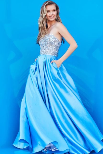 Model wearing Jovani K66689 elegant blue gown with embellishments