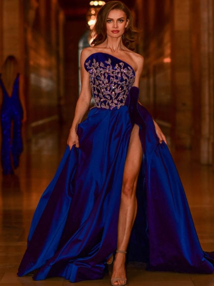 Model wearing S06347 navy gown with one-shoulder neckline and embellished bodice